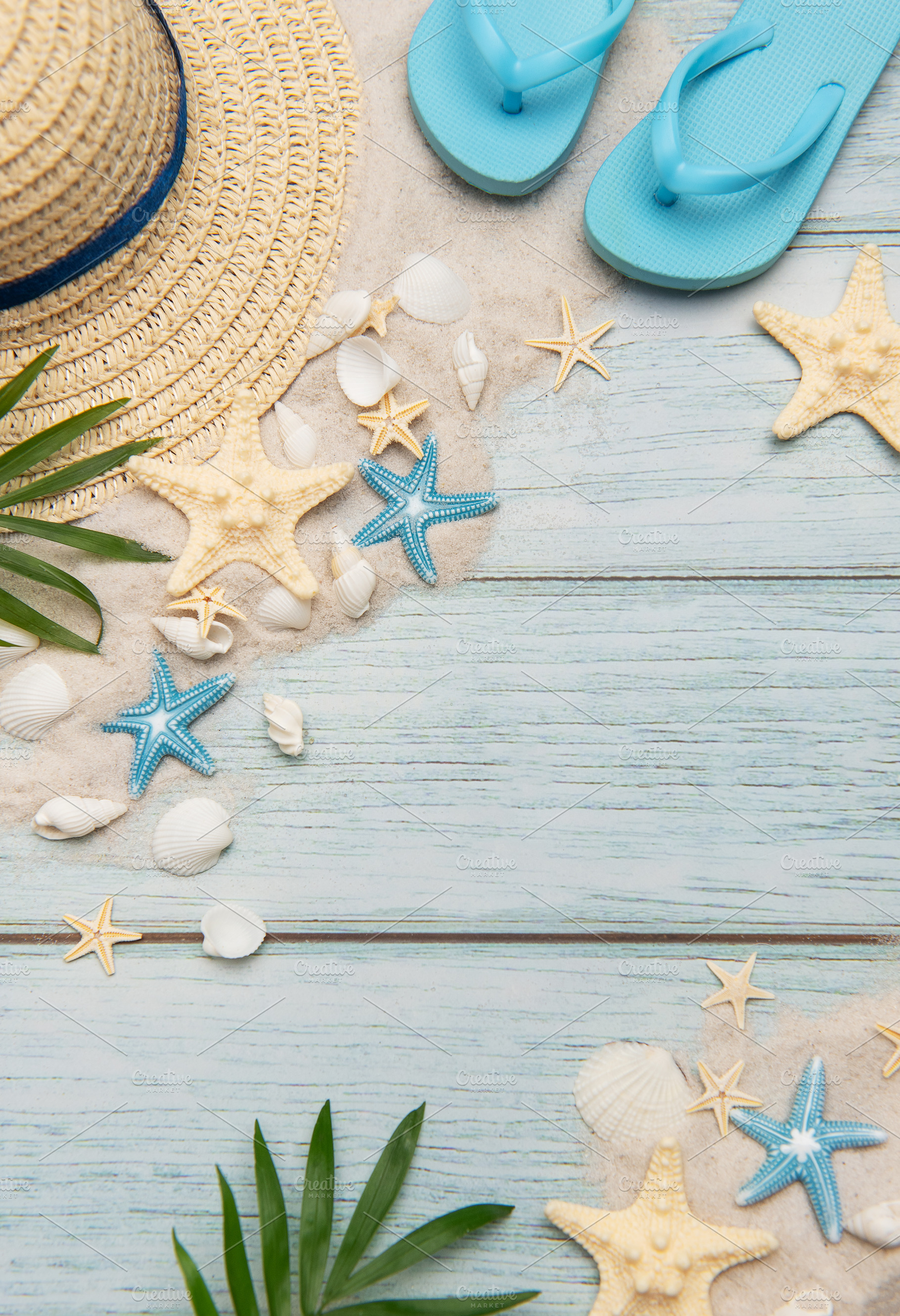 Summer accessories on blue wooden planks evoking beach holidays,, a Holiday Photo by Olena Rudo