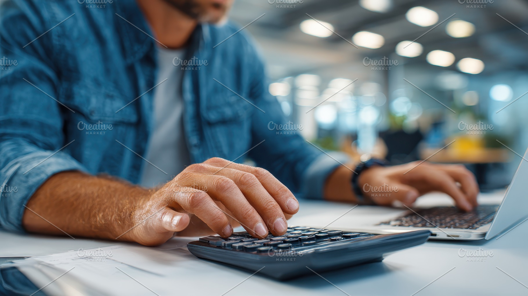 Man using calculator and laptop in o, a Photo by Pixeness Studio