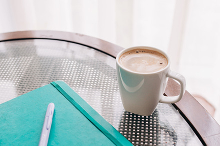 A view of a coffee and a notebook featuring creative, feminine, and pink