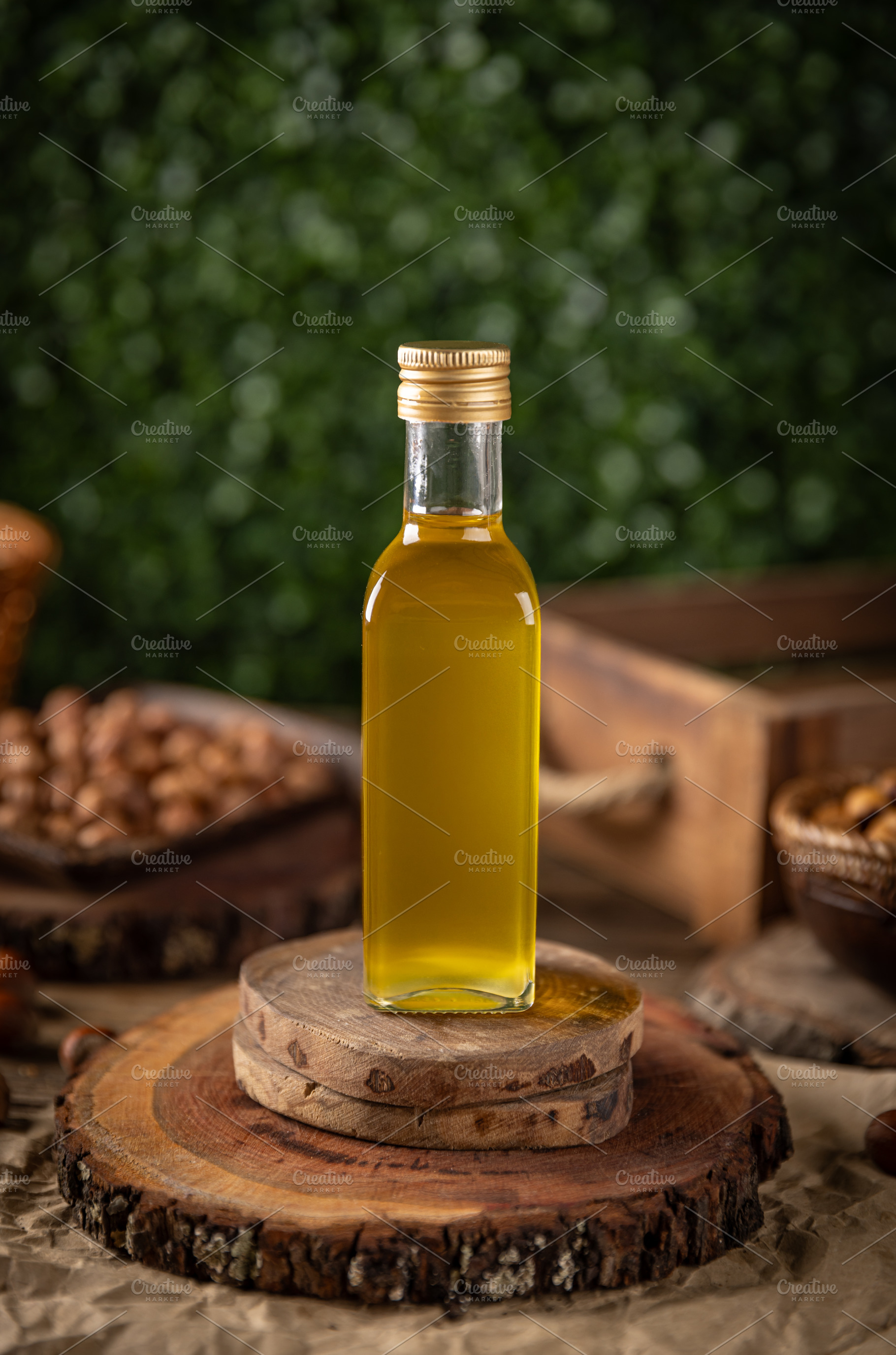 Macadamia nut oil in a glass bottle, a Photo by Grafvision photography