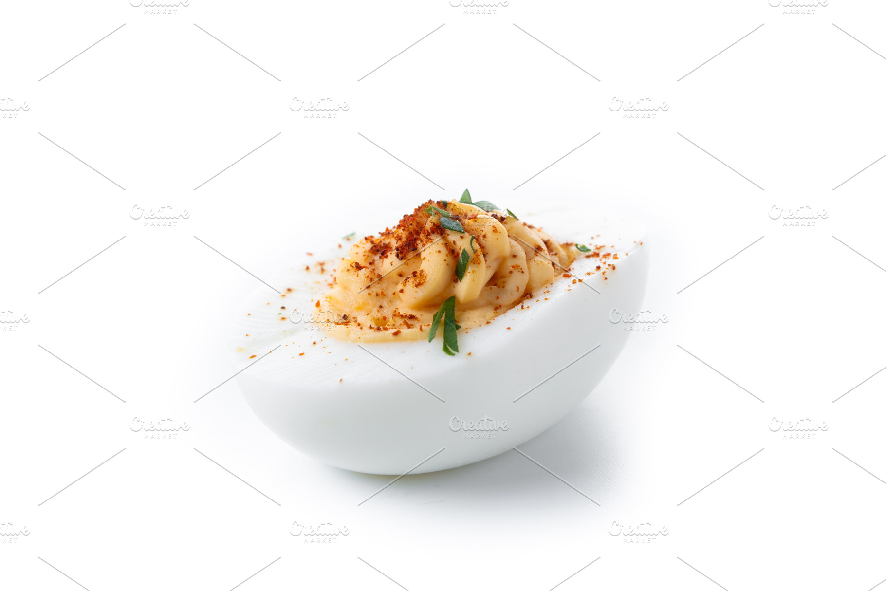 Homemade hard Boiled Deviled Eggs garnished with herbs, a Food & Drink Photo by etorres69