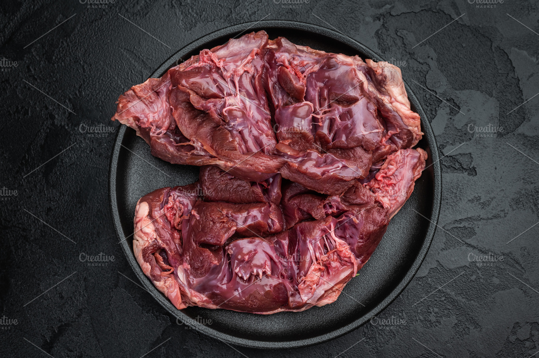 Raw veal hearts prepared for cooking highlighting tender textur, a Food & Drink Photo by composter-box@mail.ru