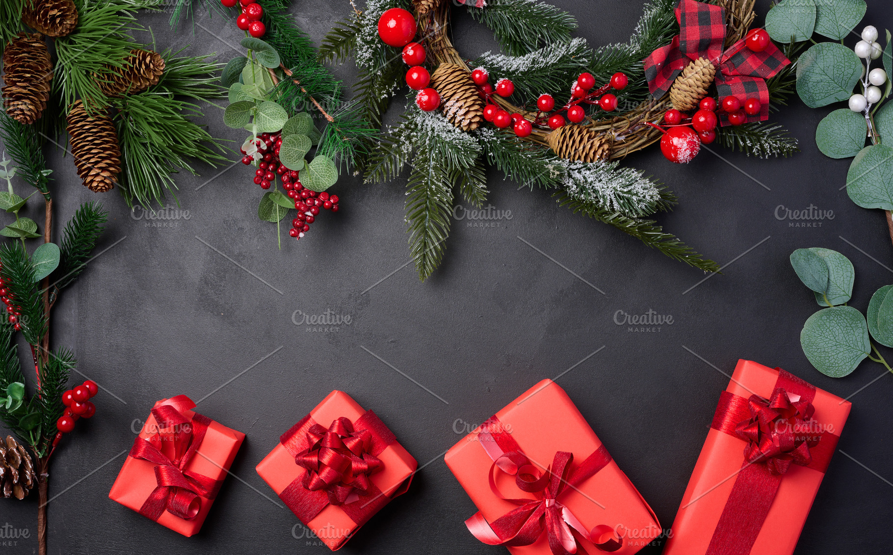 Christmas wreaths, fir branches and gifts on a black background,, a Holiday Photo by ndanko