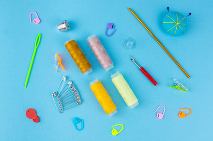 Sewing accessories on a blue bed bac, an Industrial Photo by AlexBush