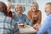 Multiracial group of positive elderly people drinking tea with cake, a Photo by Prostock-Studio (Thumbnail 2 of 2)