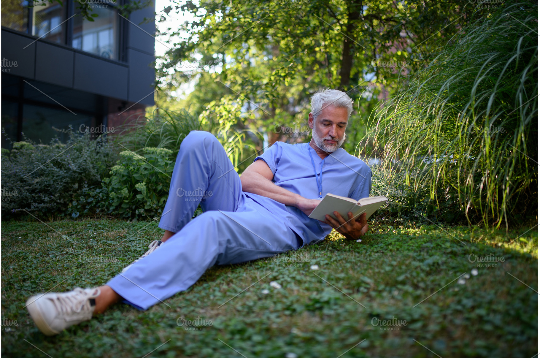 Healthcare worker resting in park, a Health & Medical Photo by HalfPoint