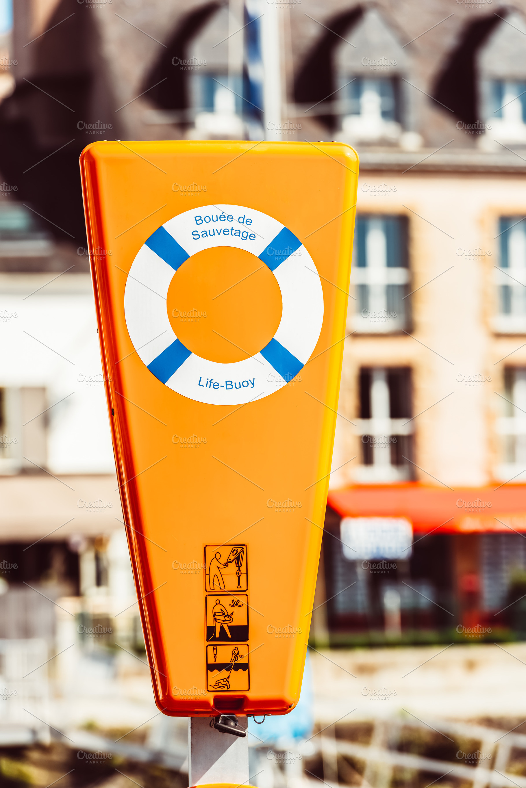 Life buoy in bright orange container, a Photo by Dvoevnore photos
