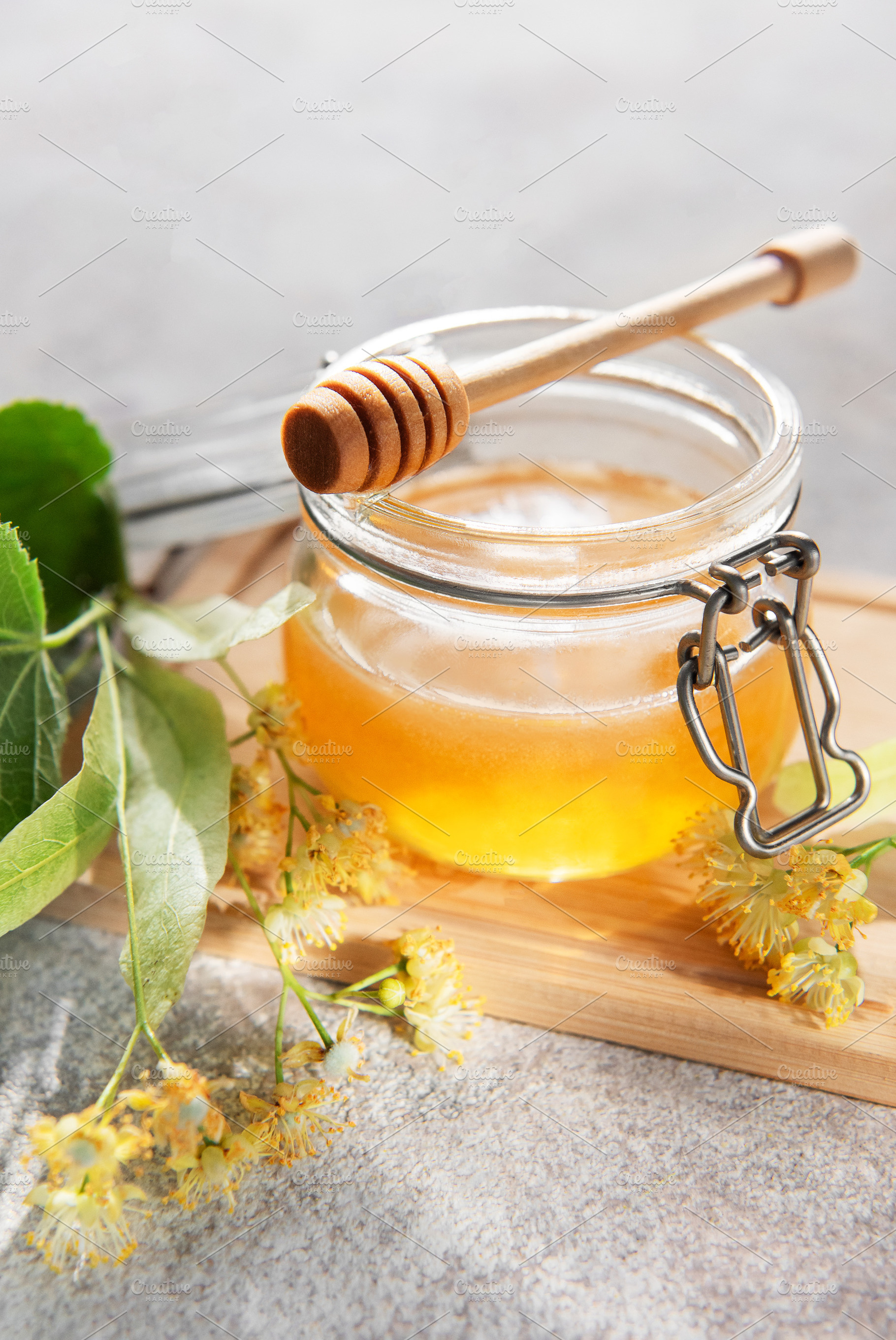 Linden honey jar with dipper and blossoms, a Food & Drink Photo by Olena Rudo