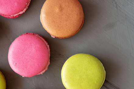 Colorful Homemade French Macarons on gray background, top view., a Food & Drink Photo by LiudmylaChuhunova