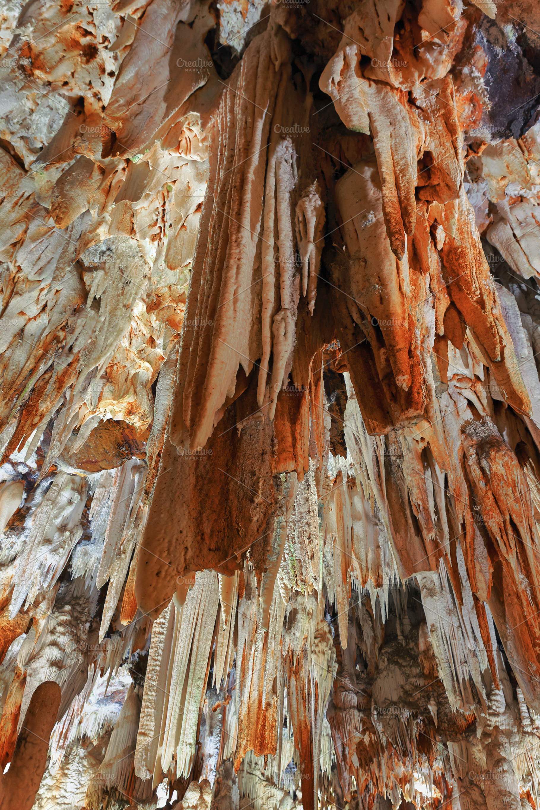 Reddish and white stalactites in an, a Nature Photo by Perpis