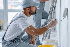 Two Painters Working Together on a W, a Photo by Pixeness Studio