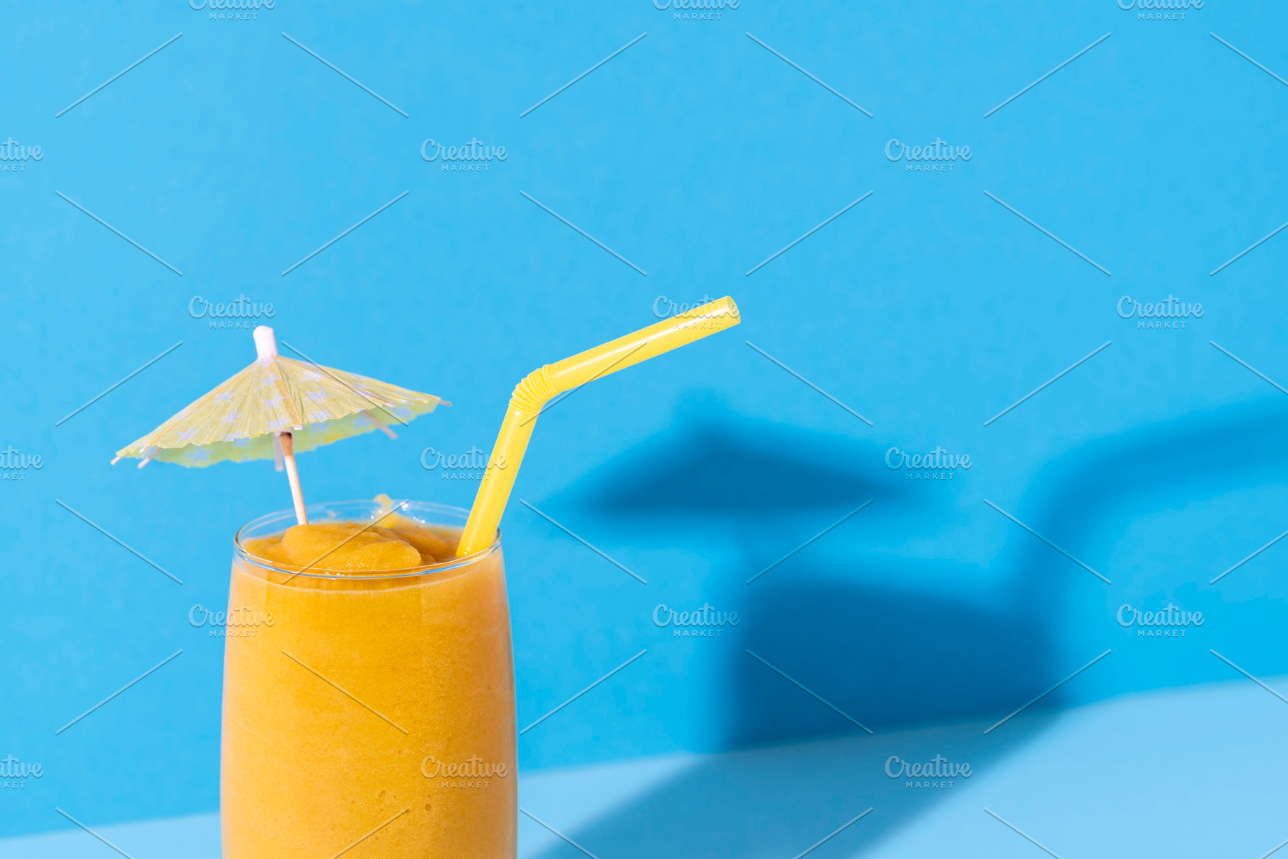 Glass of mango smoothie. Yellow slus, a Food & Drink Photo by YesPhotographers