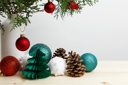 Vase with thuja branches, pinecones, and Christmas ornaments arranged for festi, a Photo by matucha