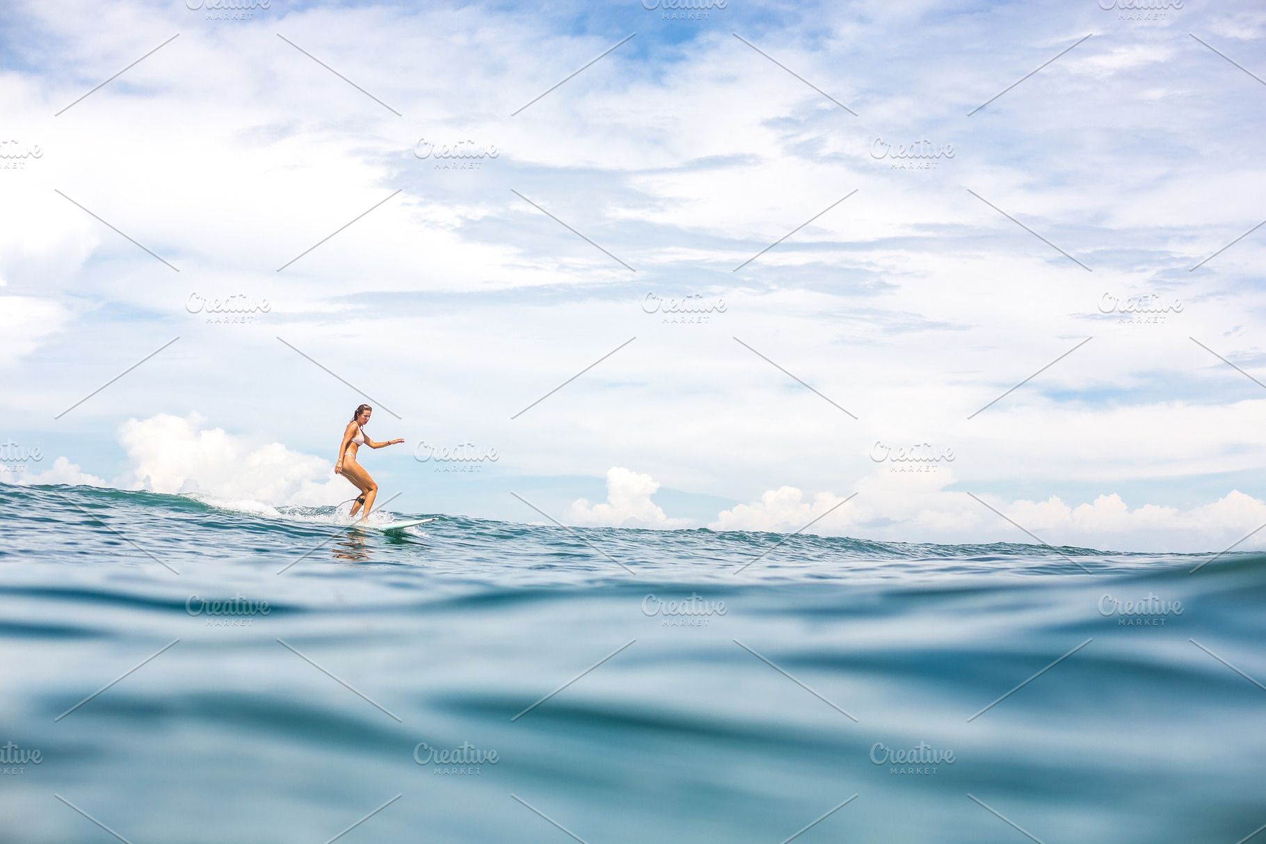 Surfing all day long containing beach, surf, and surfing, a Person Photo by Mikalai