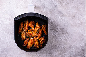 Chicken wings roasted in air fryer, a Food & Drink Photo by Yulia Furman