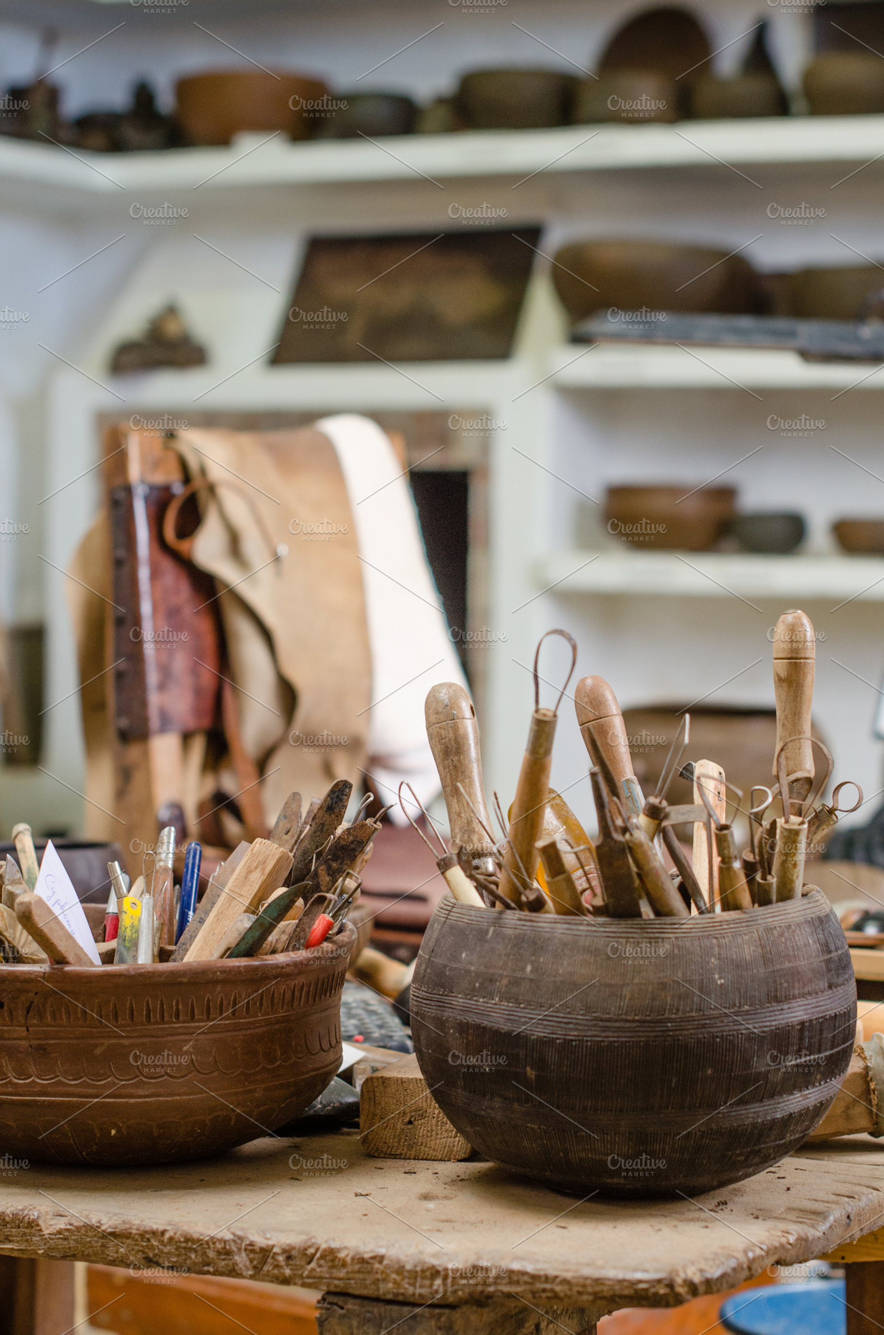 Workshop of a craftsman pottery containing art, artisan, and bowl, an Industrial Photo by BREATING NATURE