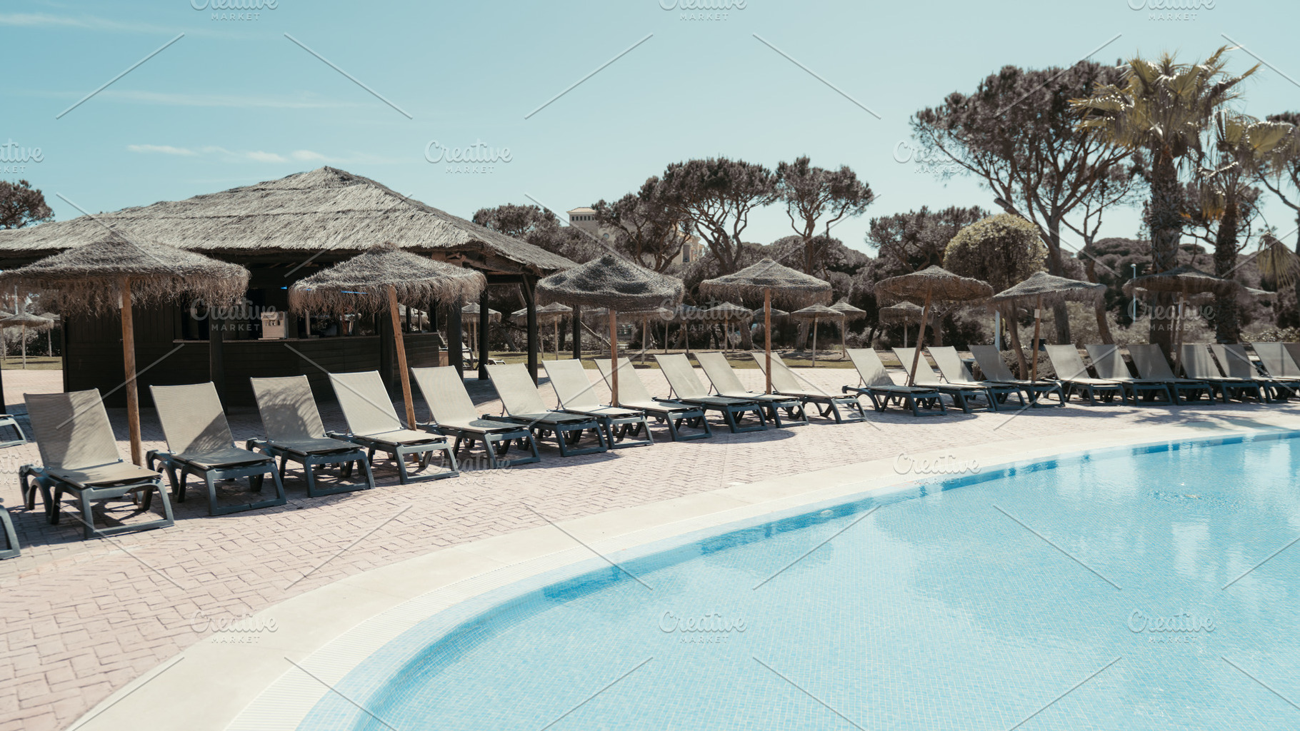 Resort pool with tiki bar, loungers, a Sports & Recreation Photo by SkyNext