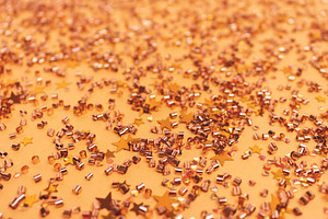 Glowing golden confetti., a Background Photo by rorygez fresh