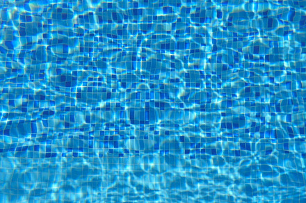 Blue water in pool beautiful background slow motion close up containing blue
