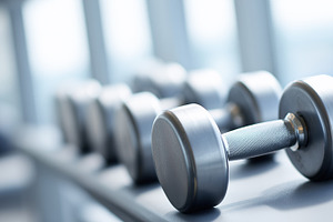 Close up on metal dumbbell in a gym, a Sports & Recreation Photo by MistyDay