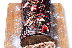 Christmas chocolate yule log cake with festive decorations, a Food & Drink Photo by etorres69