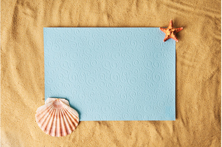 Blank paper card on sandy beach with, an Abstract Photo by Gladkov photography