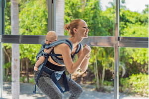 Mother doing fitness exercises while, a Sports & Recreation Photo by Elizaveta Galitskaya