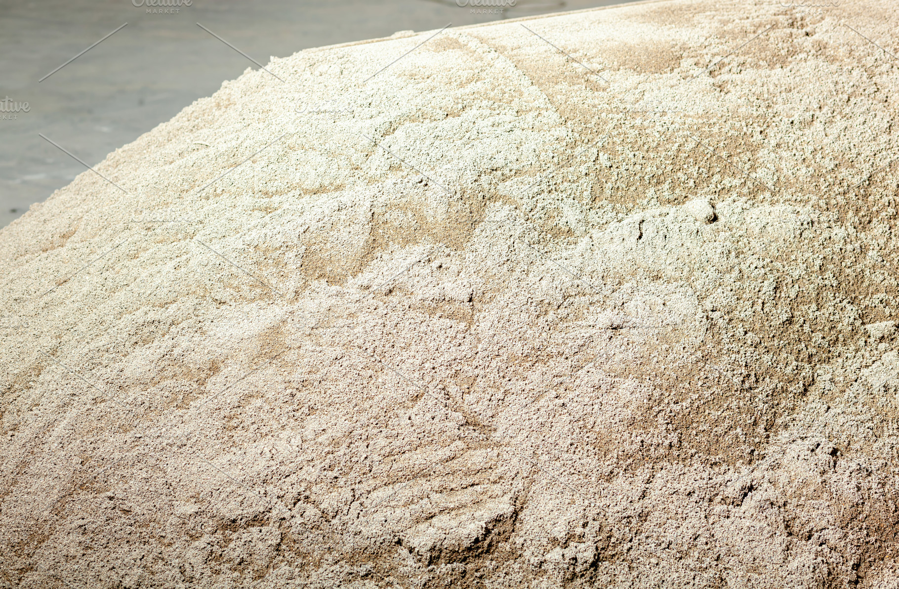 Pile of sand for cement mixing waiting to be used in construction, an Industrial Photo by Antonio Gravante Market