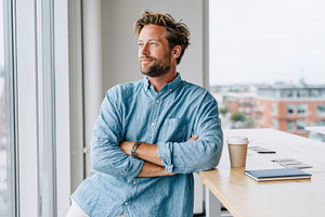 Thoughtful man in casual office setting, a Person Photo by AlyaAnd