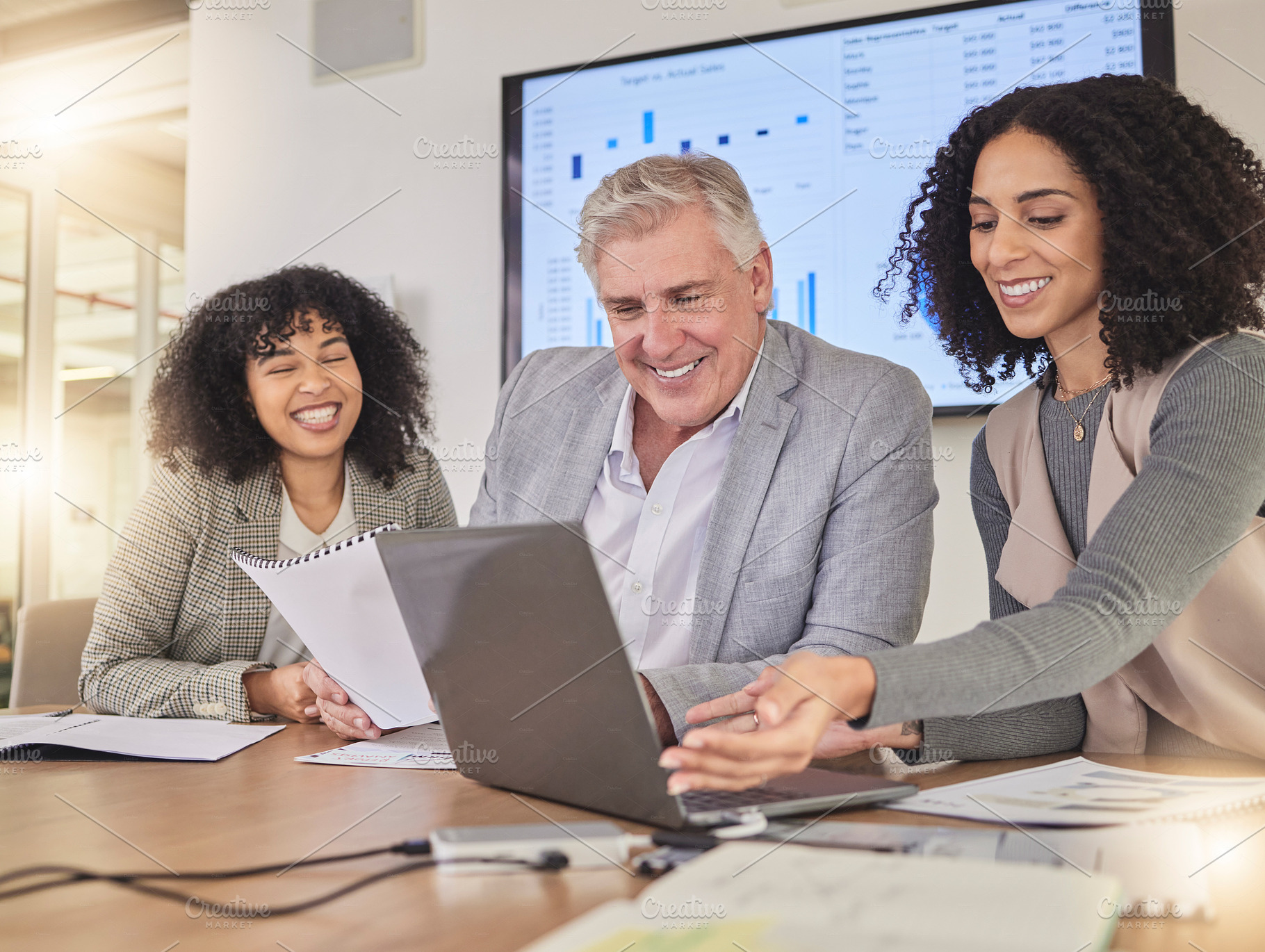 Happy, coaching and business people on laptop for creative, collaboration and project review in office. Corporate, women and mentor with report for review, planning or teamwork idea for proposal, a Photo by Peopleimages.com