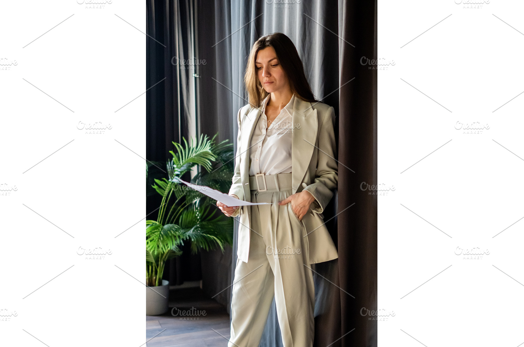 Young businesswoman with long brown, a Business Photo by undrey