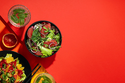 Concept of tasty food, salad with red orange, space for text, a Food & Drink Photo by AtlasStudio PRO