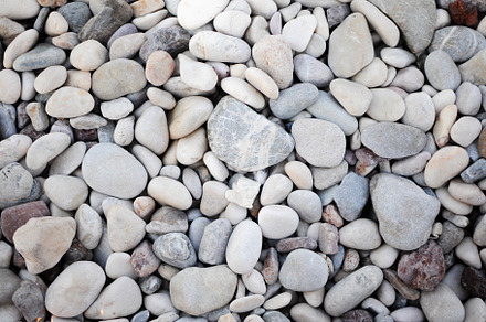 Top view texture of pebble beach, an Abstract Photo by Photo by YuraYaryna
