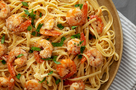 Baked Shrimp Scampi Linguine Pasta with Parsley on a Plate, top, a Food & Drink Photo by LiudmylaChuhunova