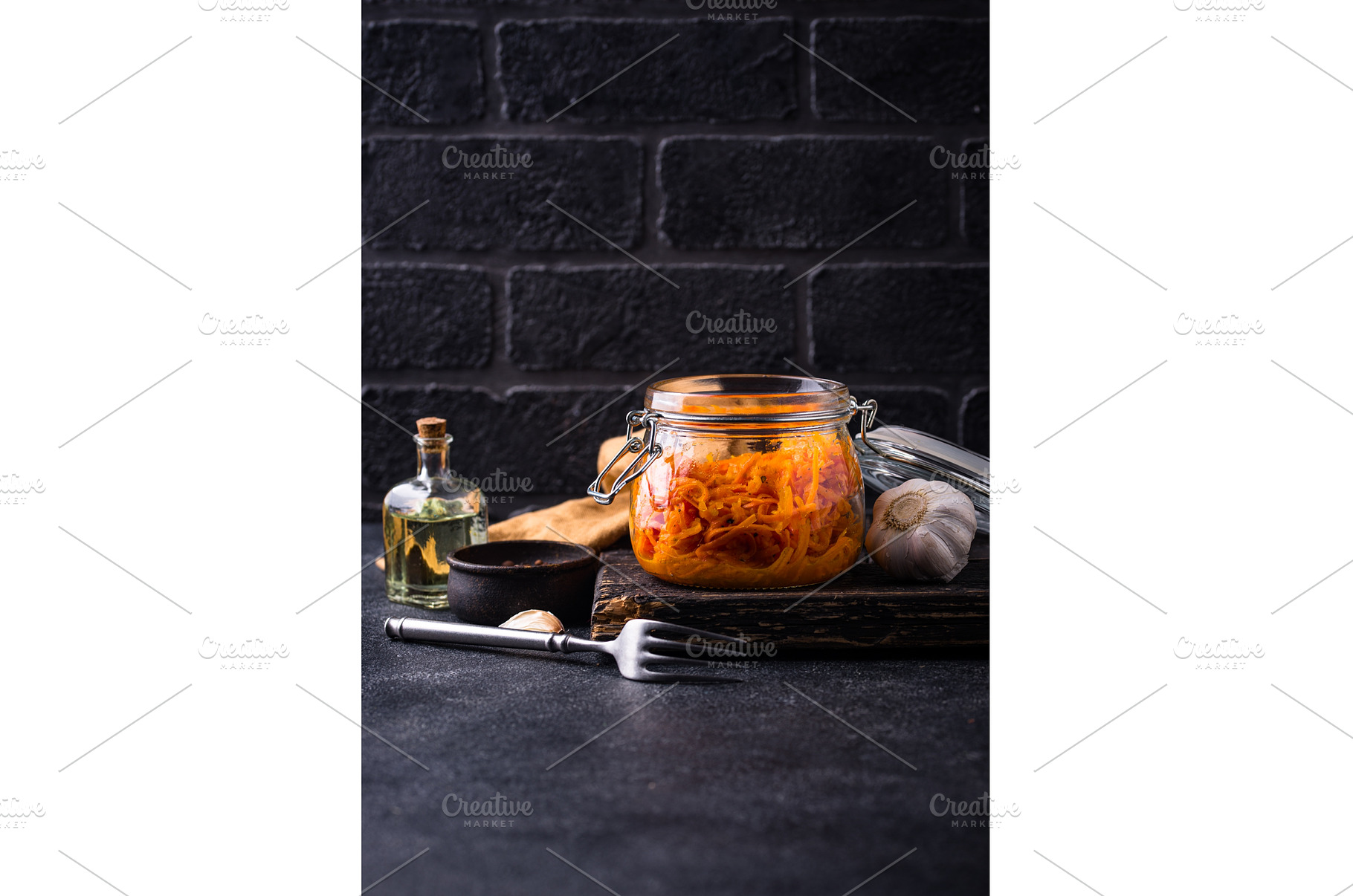 Spicy korean carrot salad in jar, a Food & Drink Photo by Yulia Furman