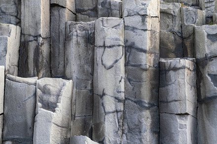 Basalt rock pillars columns at Reynisfjara beach near Vik, South, a Background Photo by YuriyB