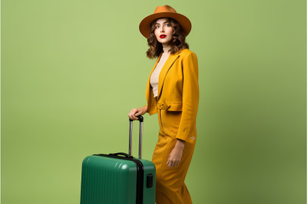 Woman traveler suitcase colorful, a Person Photo by Ylivdesign