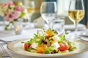 Fresh gourmet salad with feta cheese, cherry tomatoes, and arugu, a Food & Drink Photo by Studio ANNA