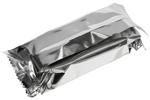 Close up of empty silver foil packaging for candy bar or snack,, a Food & Drink Photo by ndanko