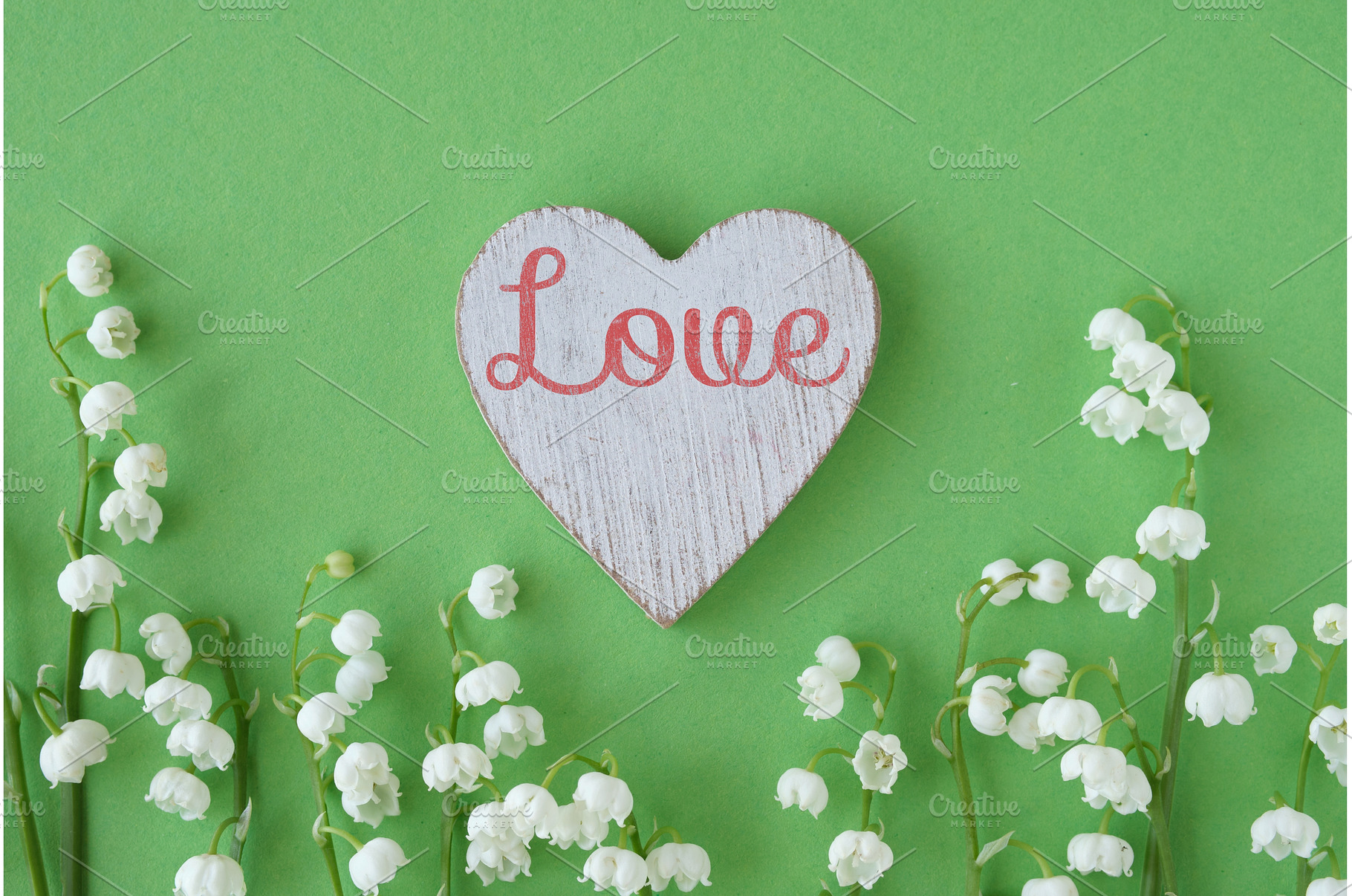 Wooden heart with text Love, a Photo by tilialucida