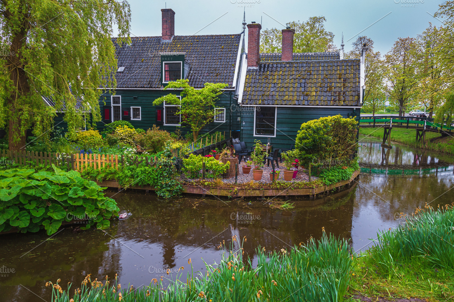 Wooden house with flowery courtyard, an Architecture Photo by Alpine Dreams