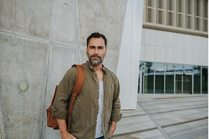 Confident middle-aged male standing, a Person Photo by HalfPoint