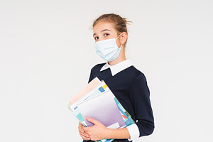 Sad teen girl in face mask stock photo containing girl and mask