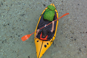 Kayaking Down the River. Caucasian Men in yellow Kayak. Soca river, Bovec, Slov, a Sports & Recreation Photo by Bepslabor