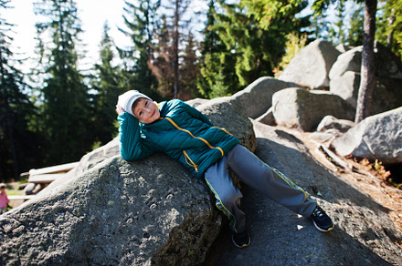 Children lying on beautiful day in mountains, resting on rock an, a Nature Photo by AS photostudio