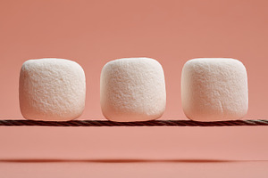 Marshmallows on a string display, a Photo by Beautiful things