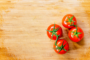 Truss Tomatoes On Wooden Background, a Food & Drink Photo by THP Creative