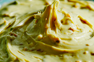 a close-up of pistachio cream in a bowl, a Photo by Nito