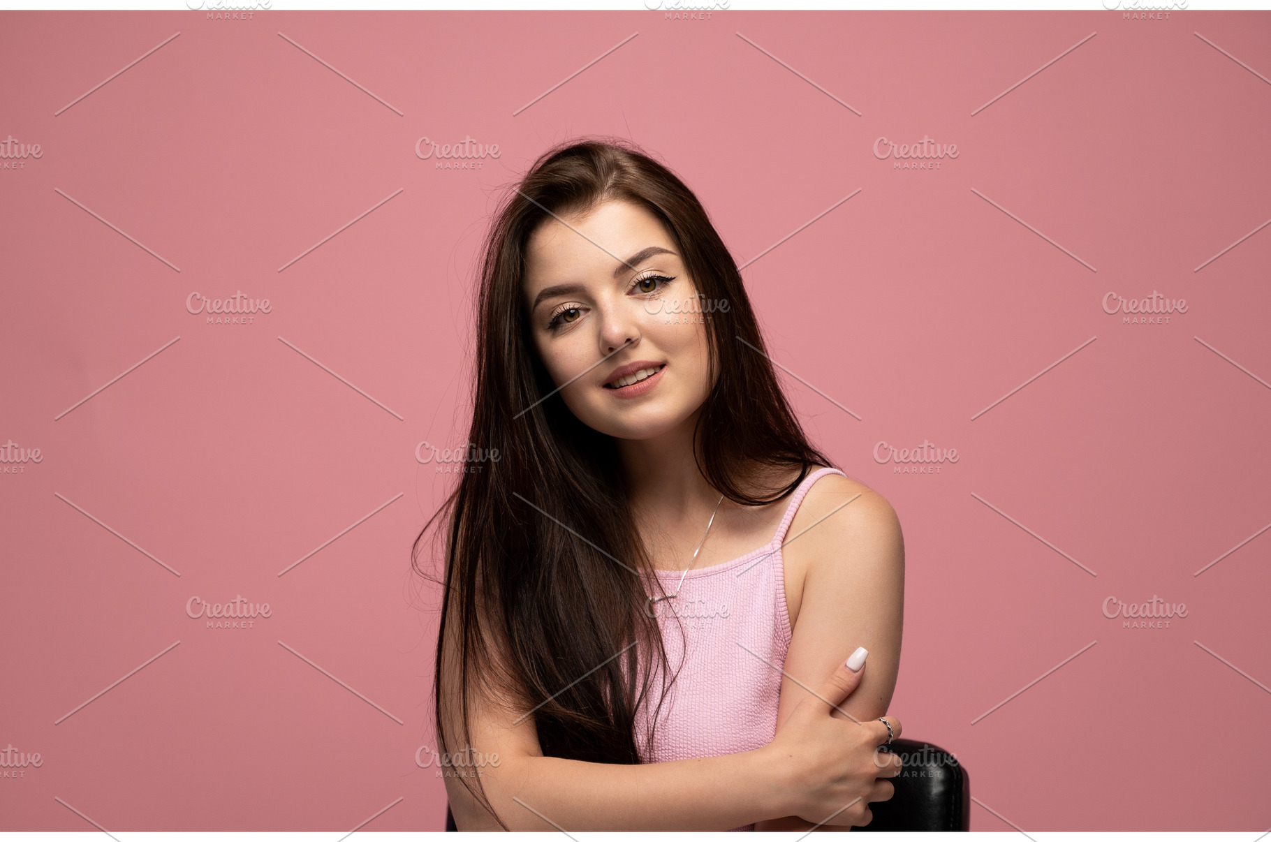 Young woman smiling, looking at, a Person Photo by volodymyrshtun13795