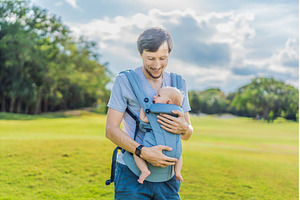 Young father walks in nature with, a Person Photo by Elizaveta Galitskaya
